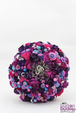 Corrina's Pink & Purple Standard Mixed Media Bouquet featured highlights of blue. Fabulous bright colours by Nic's Button Buds