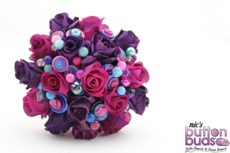 Corrina's Pink & Purple Standard Mixed Media Bouquet featured highlights of blue. Fabulous bright colours by Nic's Button Buds